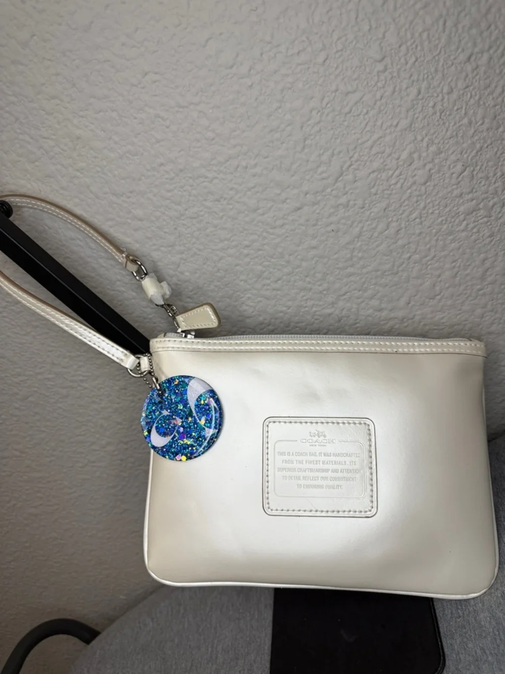 Coach Shimmering Ivory Leather Large Wristlet Clutch with Blue Glitter Charm